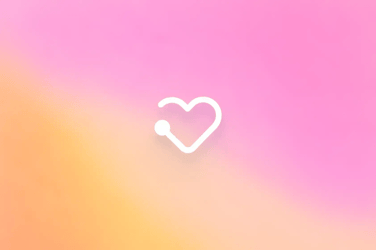 bright white heart symbol over colorful gradient background