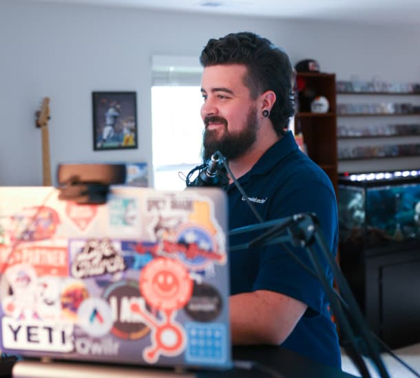 Media Junction team member Dylan working at his computer