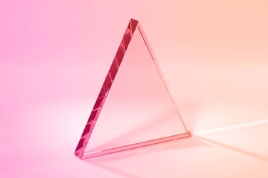 a glass triangle on a gradient background