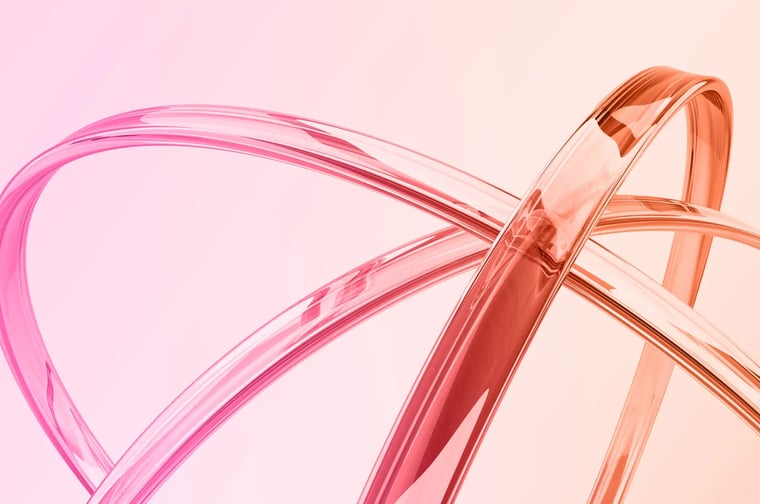 Translucent pink and coral ribbons loop and intersect in smooth arcs