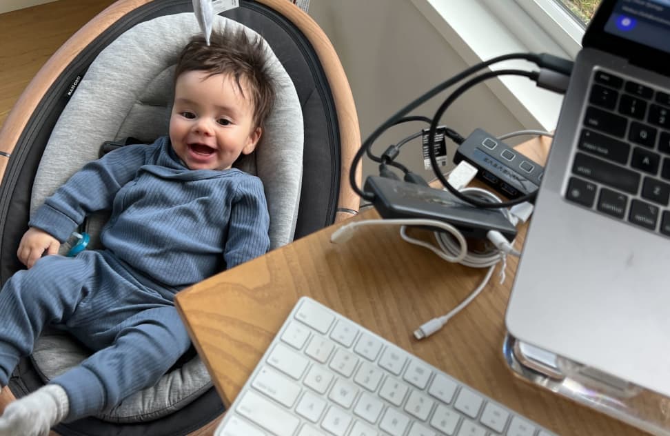 Media Junction team member working from home with their child nearby