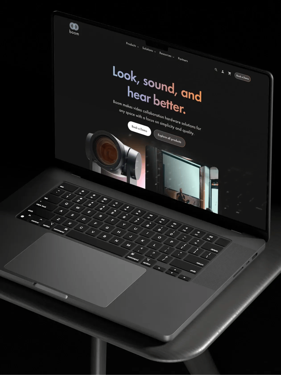 Boom Collaboration's website homepage displayed on a laptop