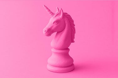 unicorn shaped chess piece on a pink gradient background representing myths