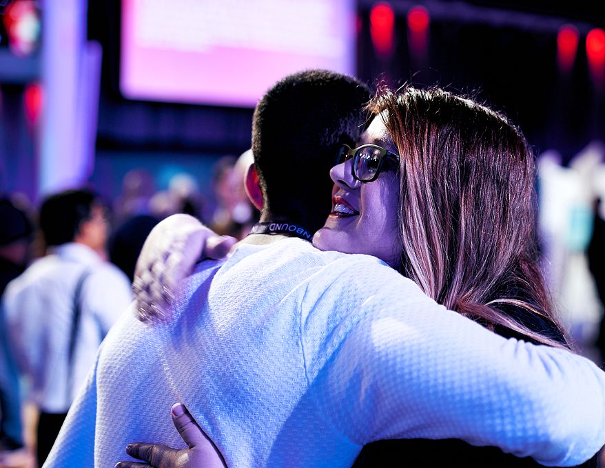 CEO Trish hugging customer