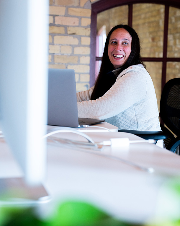 Keely smiling while working