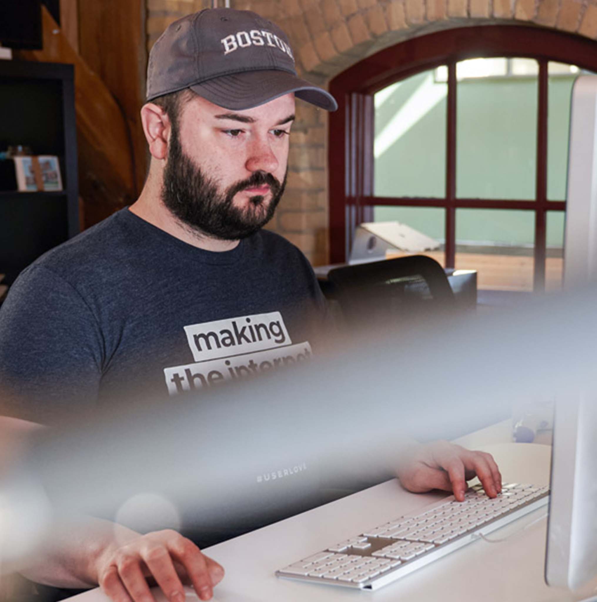 Andrew working at his desk